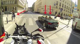 A father and a son in an convertible both look at chick's butt