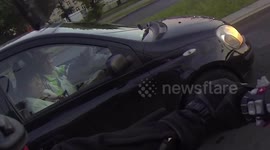 Elderly couple gives a BMW K1600GTL an amazed look