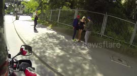 Super hot chick gets harrassed by two dudes on a sidewalk