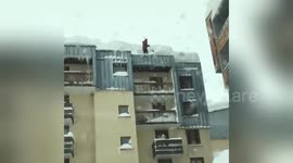 Man shovels snow off roof in French Alps resort where Briton went missing