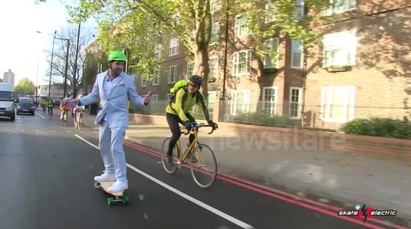 Commuter rides electric skateboard along London cycle lane