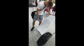 UK football team plays giant boarding pass prank on player