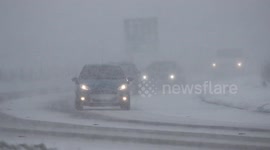 Vehicles battle through snow in Northern Ireland