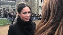 Meghan Markle and Prince Harry chatting with crowds at Cardiff Castle