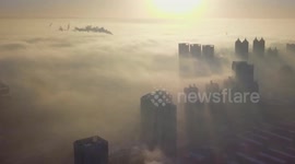 City above the clouds: Time-lapse shows dense fog in China's Shenyang