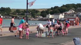 Keeping Cool with a Water Fight on Swanage Seafront