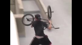 Crazy guy throws BMX bike from parking rooftop