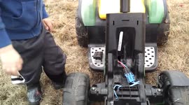 3 year old on modified Power Wheels...tractor tipping