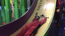 YouTuber does incredible slide at climbing gym