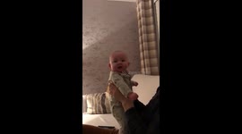 Baby giggling as getting thrown up in the air