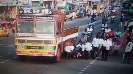 Two girls on scooter escape after falling under lorry