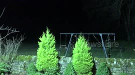 Beautiful full red moon rising over Scottish mountain
