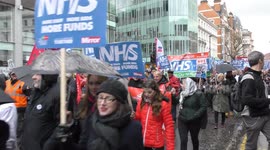 Trump says NHS 'is going broke and not working' as thousands march in London