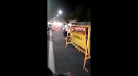 Indian police detain bikers gang for dragging traffic barricade on road