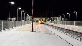 Train departure in snow Lublin airport, Poland