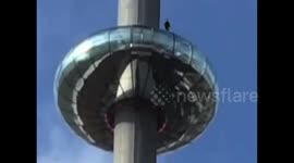 Man climbs on top of the i360
