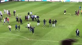 Man City striker Aguero clashes with Wigan fans after pitch invasion