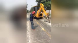 Newsflare Edit - Lads fooling around with JCB drill