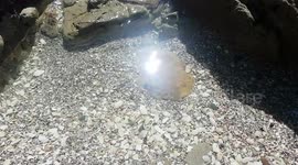 Creative interplay of sunlight and flow of water in ocean rock pool