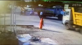 Man knocked down by dump truck gets back on his feet instantly