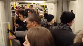 Packed London underground after snow causes delays