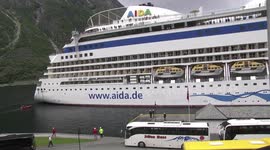 AIDAbella docking, coaches waiting Eidfjord