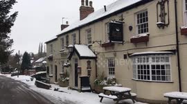 Scenes from snowy village in England