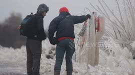 Onlookers Admiring Amazing Ice Formations