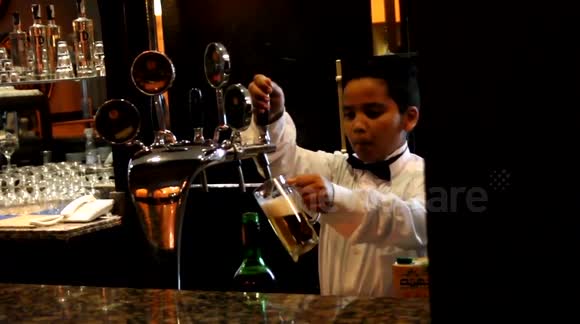 Underage bartender pulls pints in Egyptian bar - Buy, Sell or Upload Video Content with Newsflare
