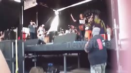 Singer Jumps Off Stage and Fights a Security Guard Who Pushed a Fan