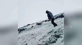 Newsflare Edit - Guy faceplants while sledging