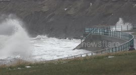 Stormy sea at St. Mary's Lighthouse during Flood alert for WhitleyBay