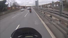 Man on motorbike follows scooter with no plate in London