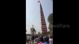 Terrifying moment 100-foot chariot falls on power lines