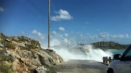 Man swept off bridge by giant waves in Bahamas