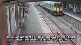 Moment unattended buggy almost rolls into oncoming train