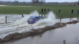 Rally racetrack changed to large water pool after heavy rainfall.