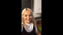 Girl gets the bread in the toaster from far away (SHOT)