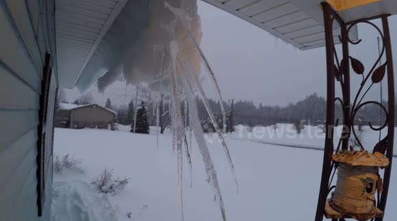 Scary ice hanging from house