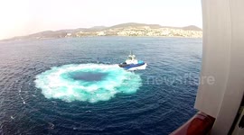 Tugboat performing a risky manouver in front of the cruise