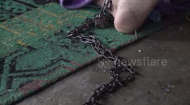 Sleeping with chained legs