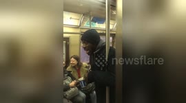 Busker brightens New Yorkers' day with rousing rendition of 'Lean on Me'