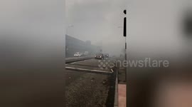 Ground shot shows Glasgow covered in thick grey smoke from fire
