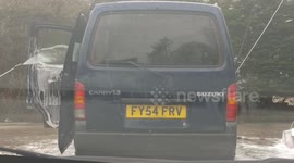 Man washes the inside of his van with pressure washer