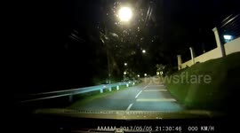 Driver comes face-to-face with 'ghost' sitting in road