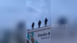 Sculptures of men standing on London building raise awareness on suicide