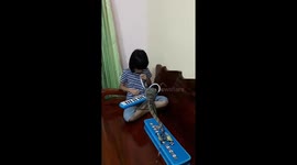 Meanwhile in Thailand a girl plays melodica for a monitor lizard