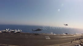 Explosive Ordinance Disposal team practice fast deployment on aircraft carrier