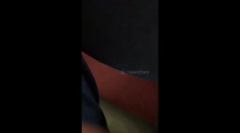 Woman angers plane passengers by laying across premium seats