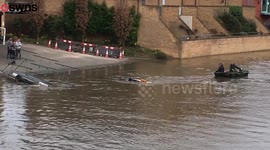 Truck almost completely submerged in river
